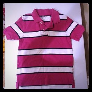 Pink polo with white and black stripes